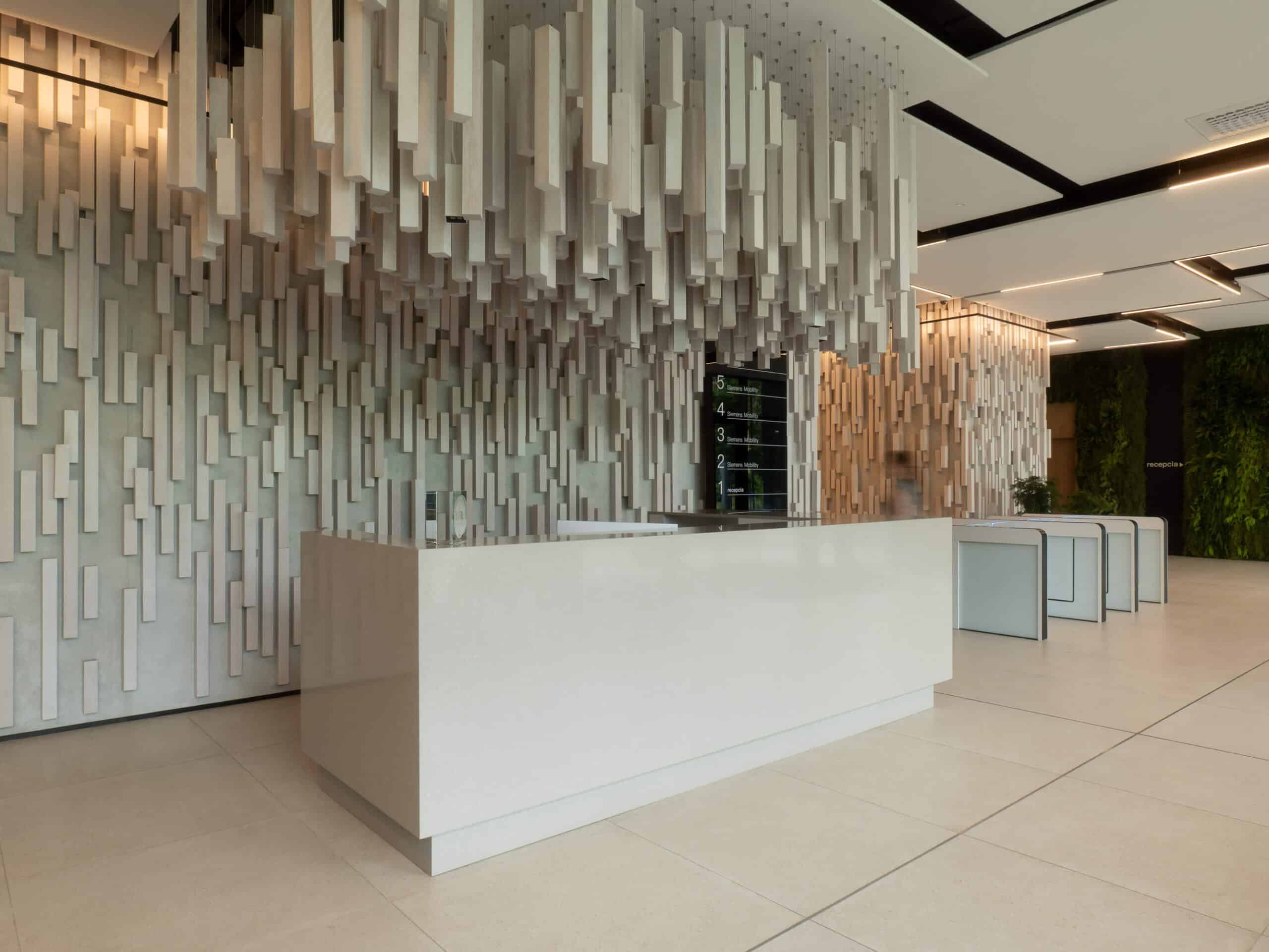 Realizácia - Recepčný pult z Technistone Noble Ivory White